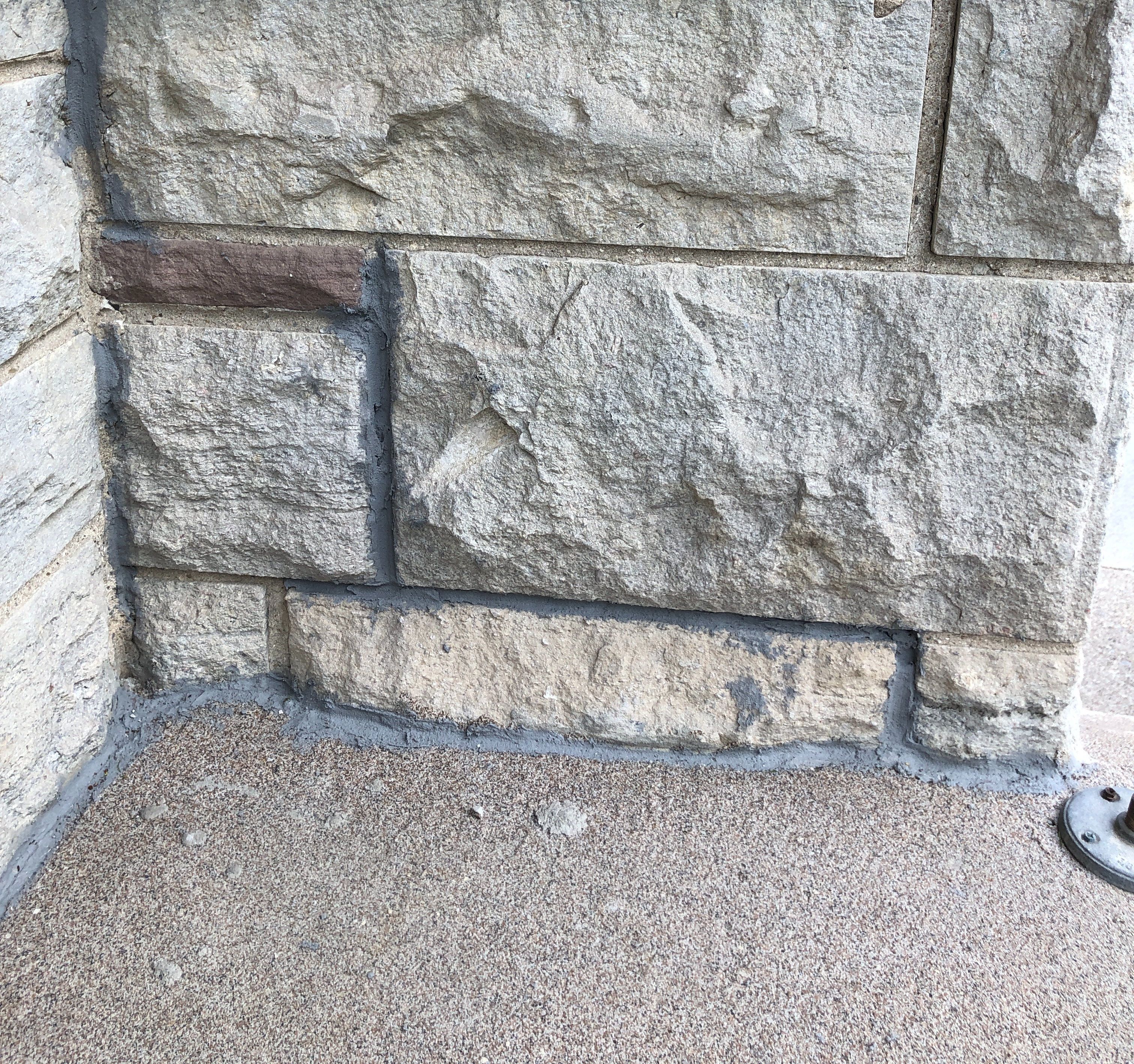 Stone wall on our front porch, with new mortar.